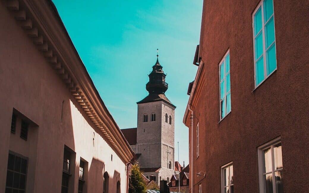 the visby cathedral as seen from an alley