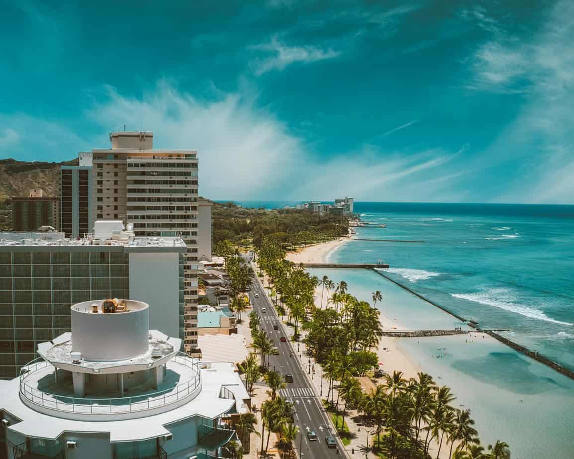 aerial view of city buildings near body of water
