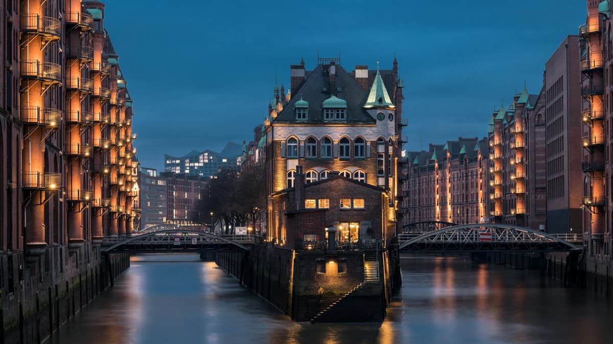 illuminated speicherstadt in hamburg at dusk germany
