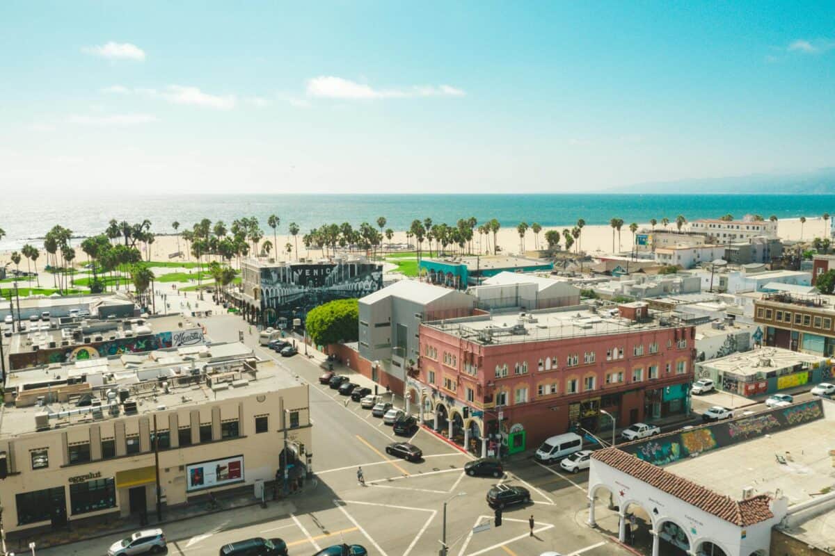 aerial view of concrete buildings near ocean