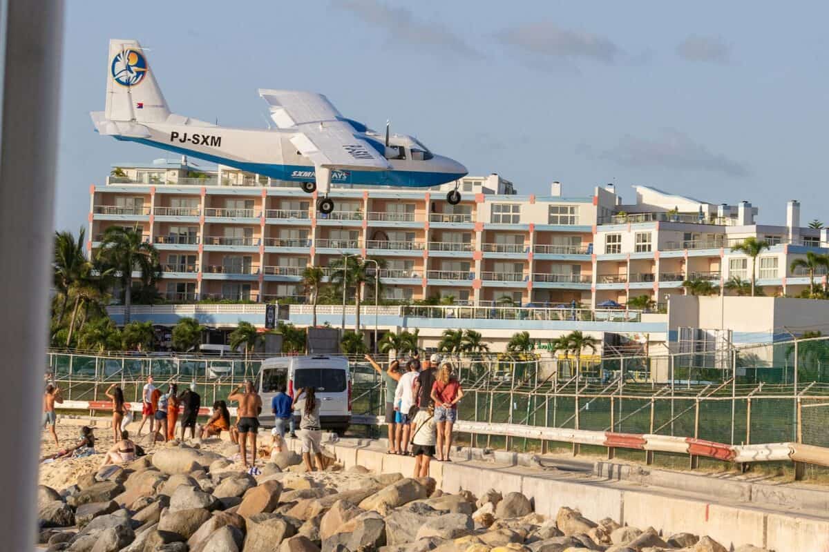 low flying plane landing at maho beach st maarten