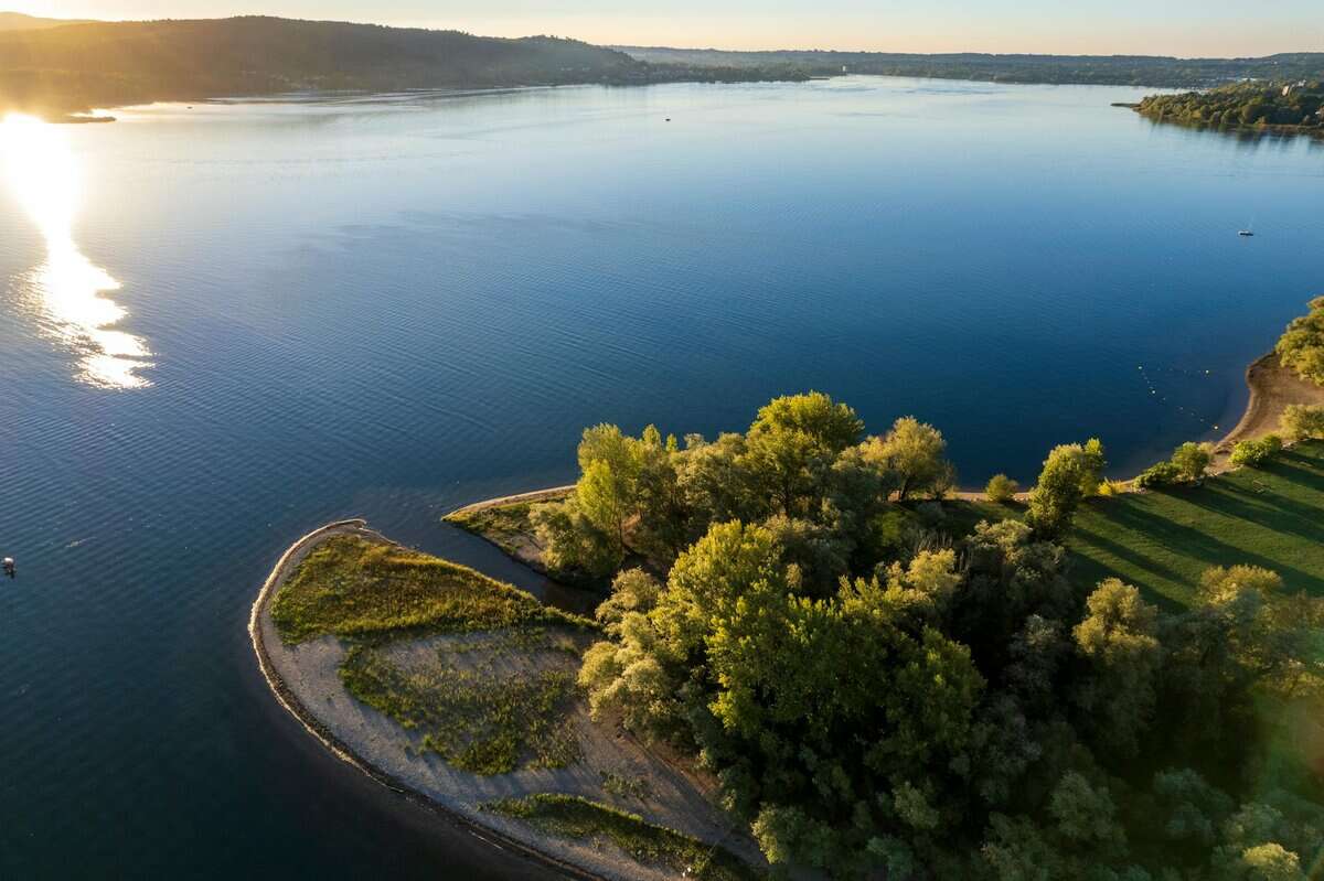 aerial view of serene lake varese at sunrise