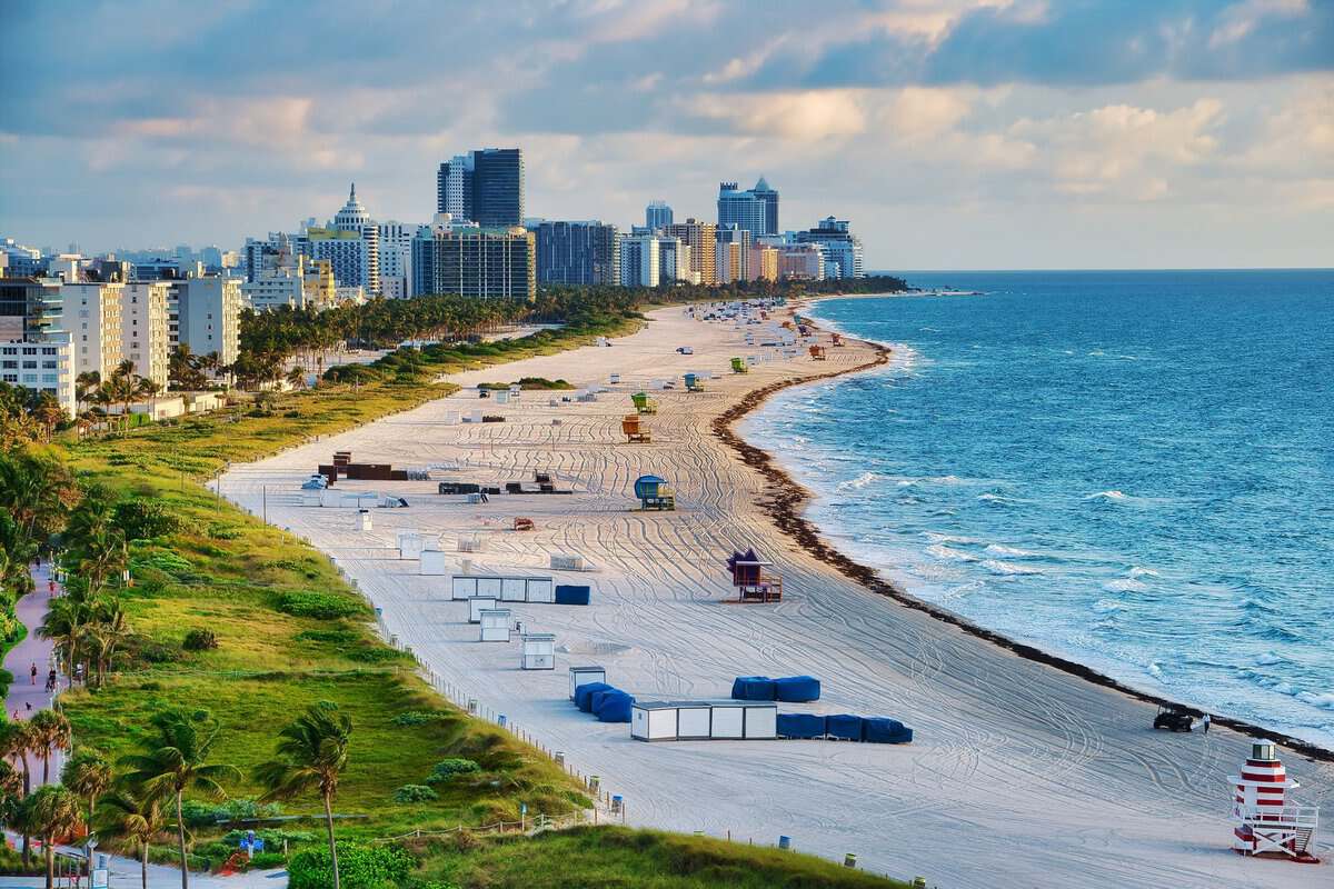 aerial view of city buildings beside the ocean